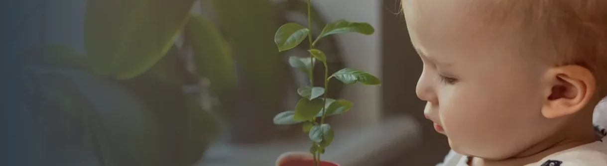 baby with plant